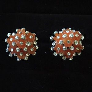 Beautiful orange floral cluster with rhinestone added detail post earrings.